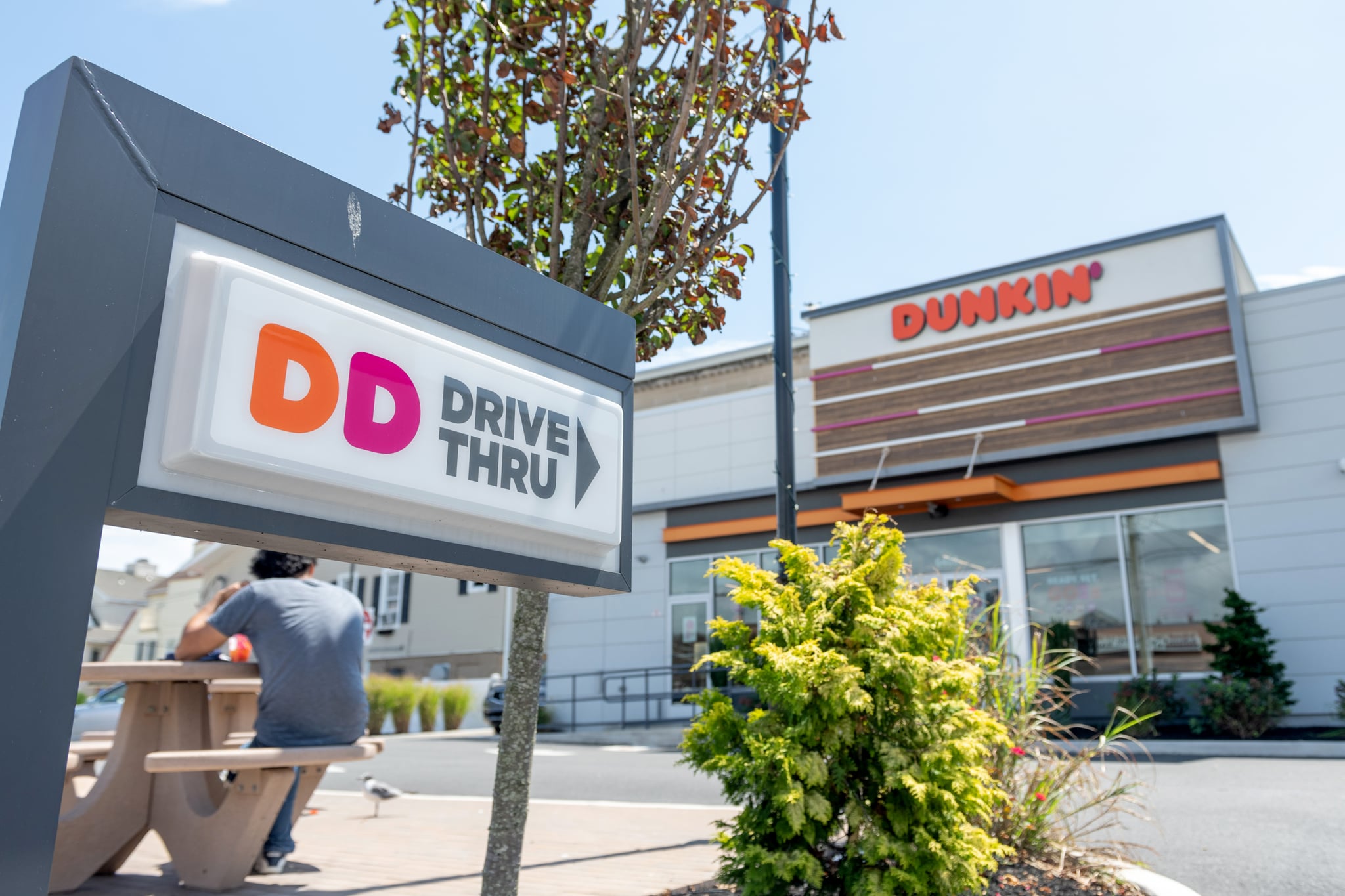 VENTNOR CITY, NEW JERSEY - AUGUST 14: A view of a Dunkin' Donuts drive through sign is seen as the state of New Jersey continues Stage 2 of re-opening following restrictions imposed to slow the spread of coronavirus on August 14, 2020 in Ventnor City, New Jersey. Stage 2, allows moderate-risk activities to resume which includes pools, youth day camps and certain sports practices.  (Photo by Alexi Rosenfeld/Getty Images)