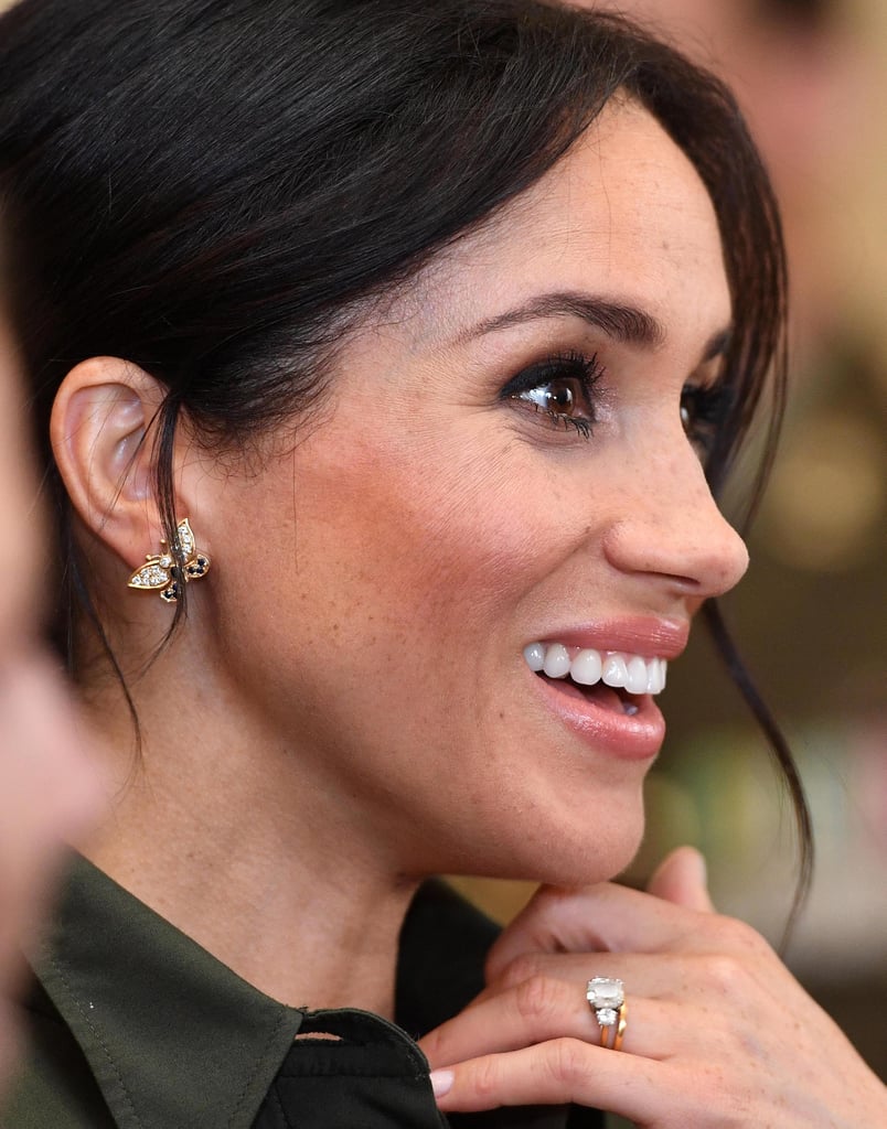 Meghan's gold and diamond butterfly earrings were a tribute to Princess Diana while in Sydney with Prince Harry. She borrowed these from the late princess's collection for her travels.