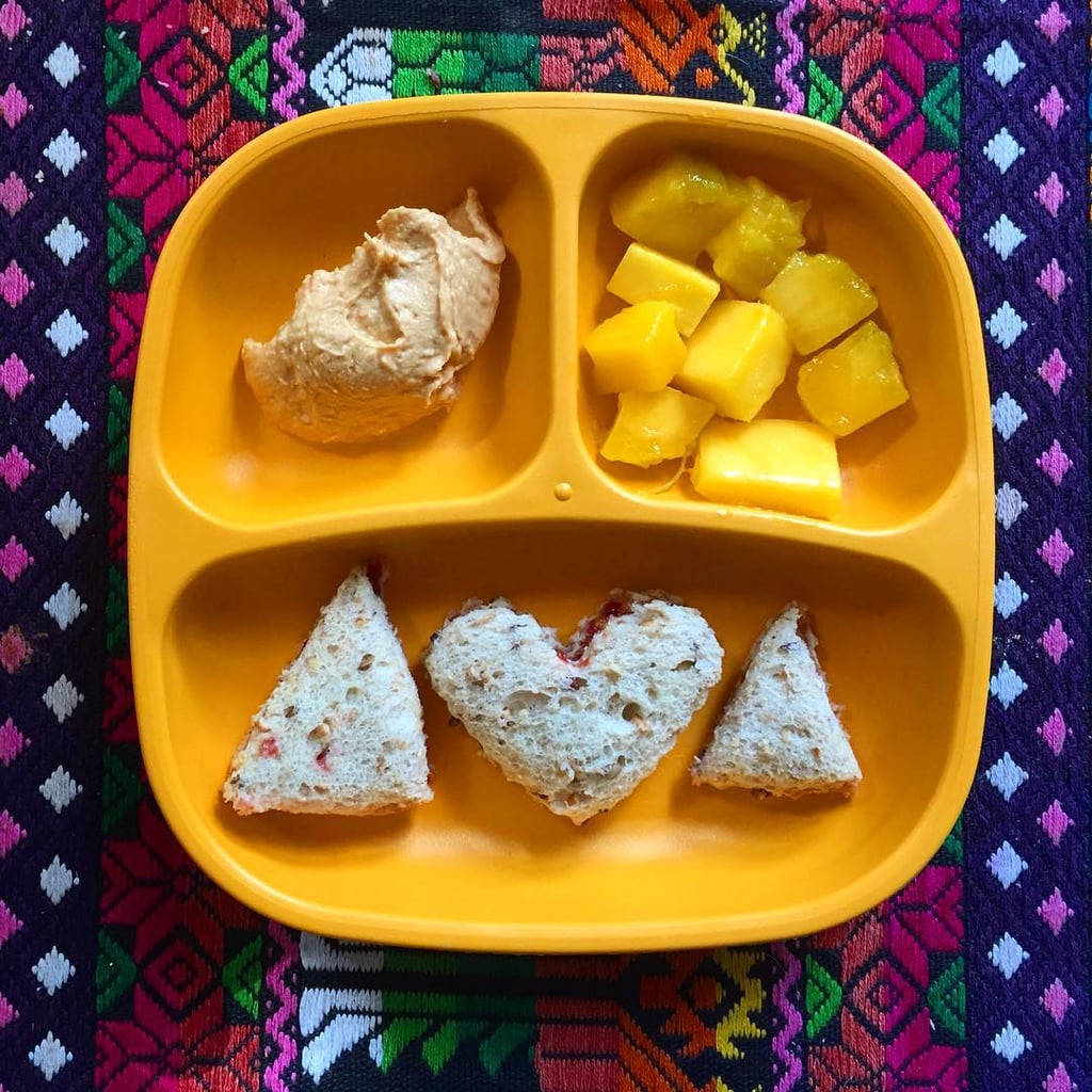 "Lunch sunflower butter and jam sandwich on whole grain bread, red