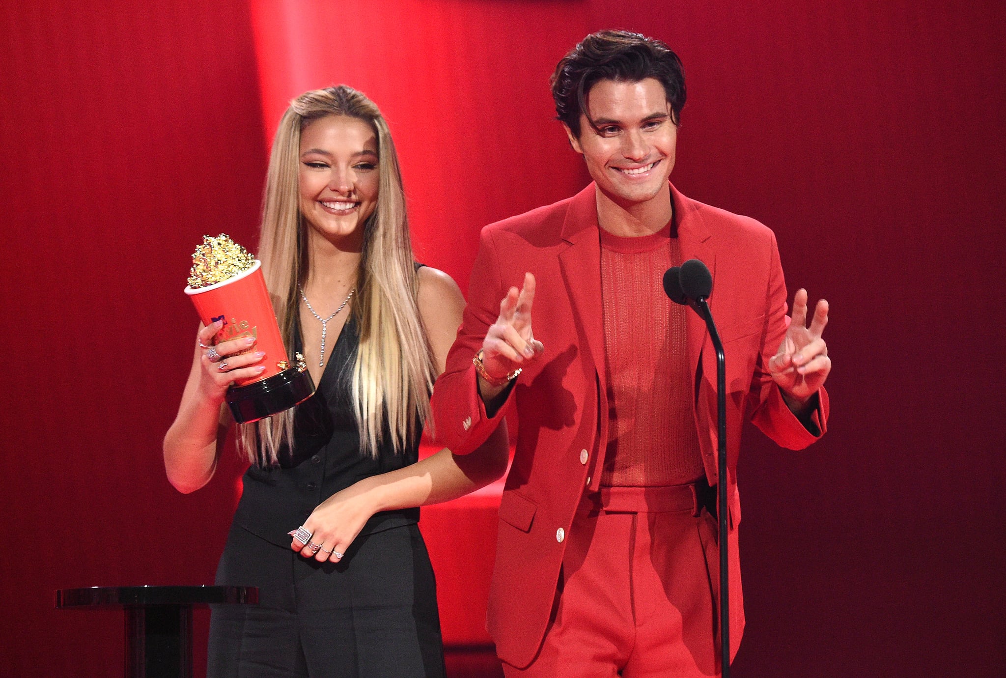 Madelyn Cline and Chase Stokes accept the Best Kiss award for 'Outer Banks' onstage during the 2021 MTV Movie & TV Awards at the Hollywood Palladium on May 16, 2021 in Los Angeles, California.