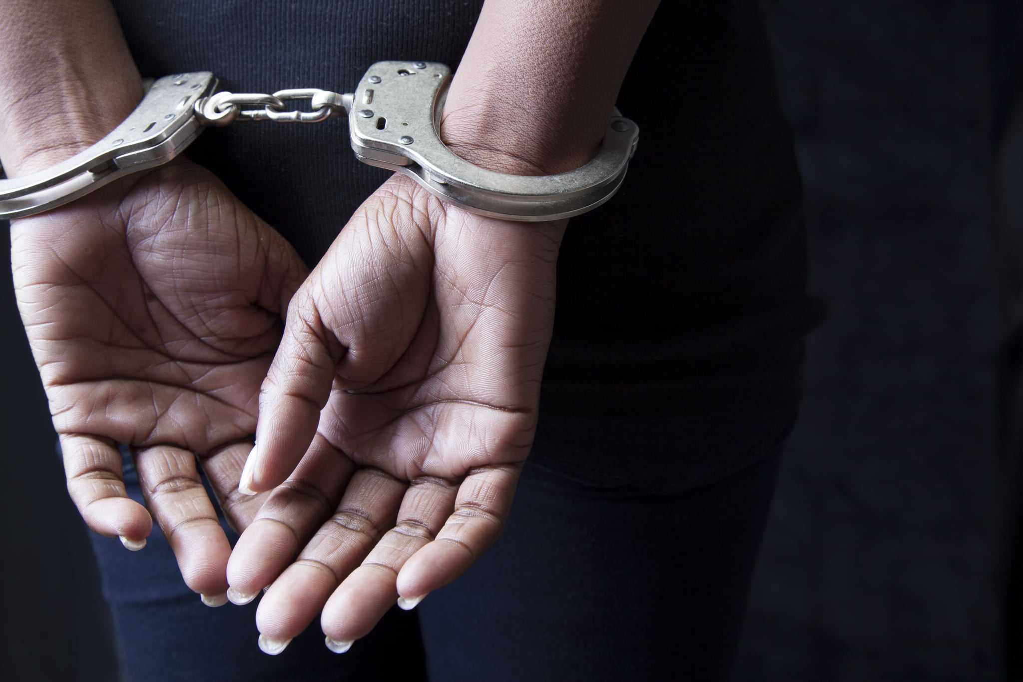 Black woman in handcuffs