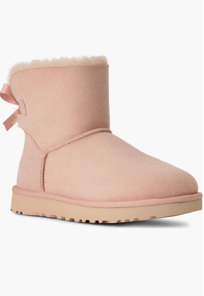 UGG Mini Bailey Bow II Genuine Shearling Bootie ($125, originally $180)
With plenty of brisk days ahead, an UGG bootie is something they can wear every day. They include a genuine shearling lining and a Treadlite by UGG™ sole for added cushioning, traction, and durability. Plus, the satin bow on the back is too chic to resist.