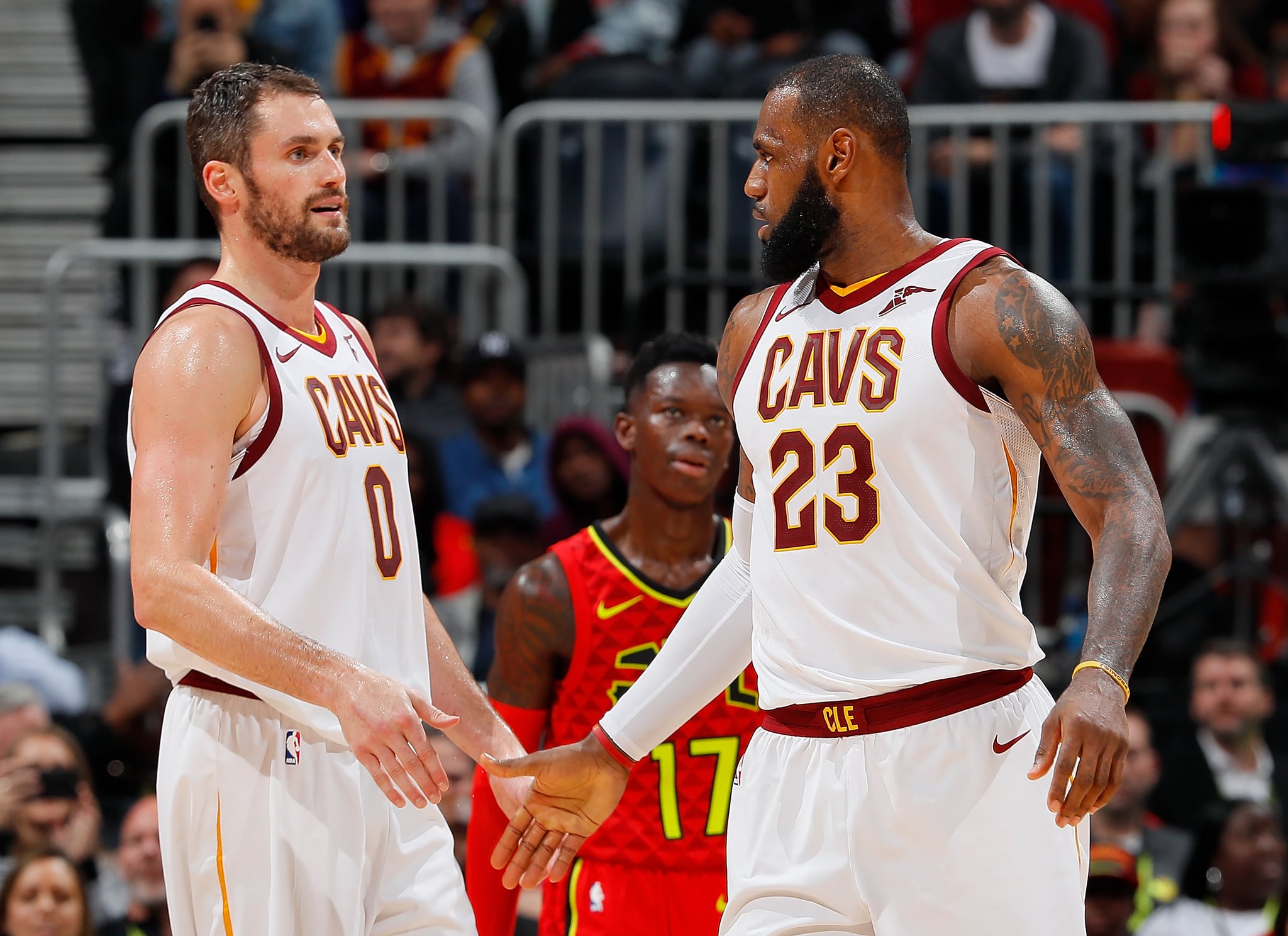 ATLANTA, GA - NOVEMBER 30:  LeBron James #23 of the Cleveland Cavaliers reacts with Kevin Love #0 after drawing a foul against the Atlanta Hawks at Philips Arena on November 30, 2017 in Atlanta, Georgia.  NOTE TO USER: User expressly acknowledges and agrees that, by downloading and or using this photograph, User is consenting to the terms and conditions of the Getty Images Licence Agreement.  (Photo by Kevin C. Cox/Getty Images)