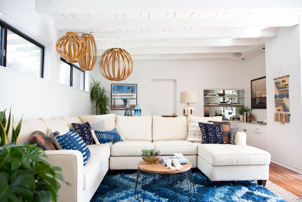 Jamie told us that the living room was in need of some pops of color, better lighting, and a new couch. Decorist did not disappoint, bringing in a beautiful white sectional, vibrant blue rug, and some seriously unique pendant lights.