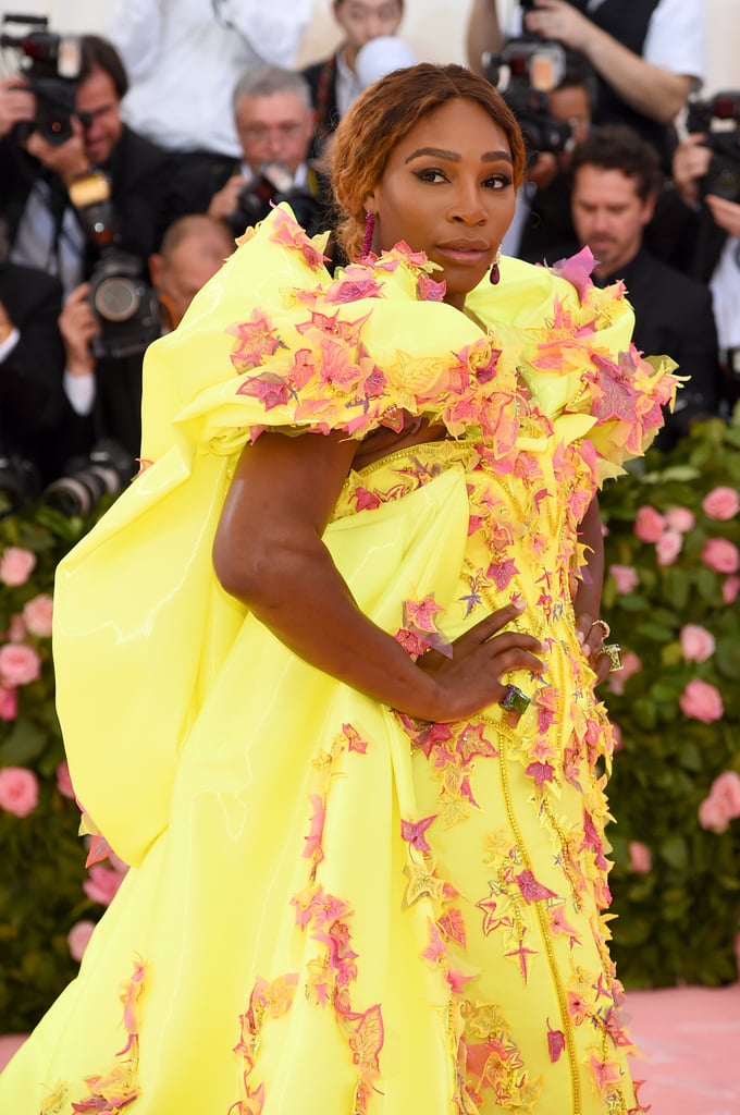 In a Versace gown and de Grisogono jewelry.