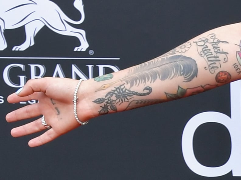 Julia Michaels's Scorpion, Feather Pen, and "Just Breathe" Tattoos