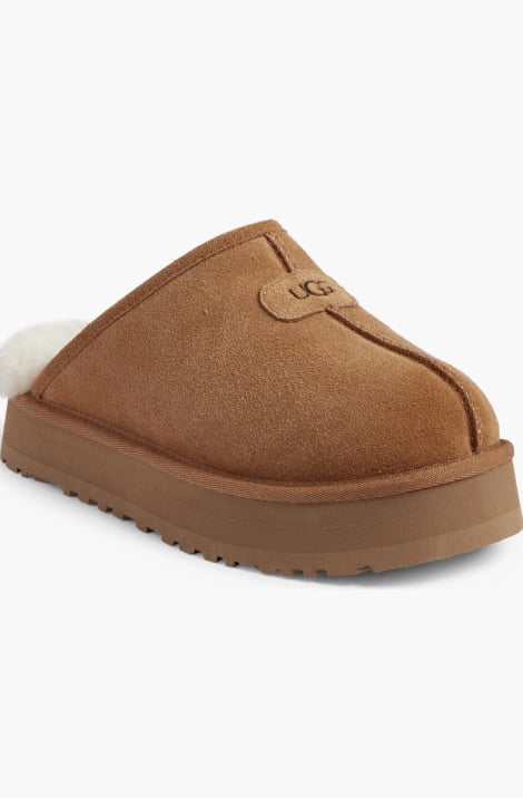 UGG Discoquette Slide Slipper ($75, originally $110) 
Keep it cute and cozy this winter with the comfiest footwear money can buy. Although these slides might technically fall under the "slippers" category, you'll still catch me rocking these all through the holiday season — they're that versatile.