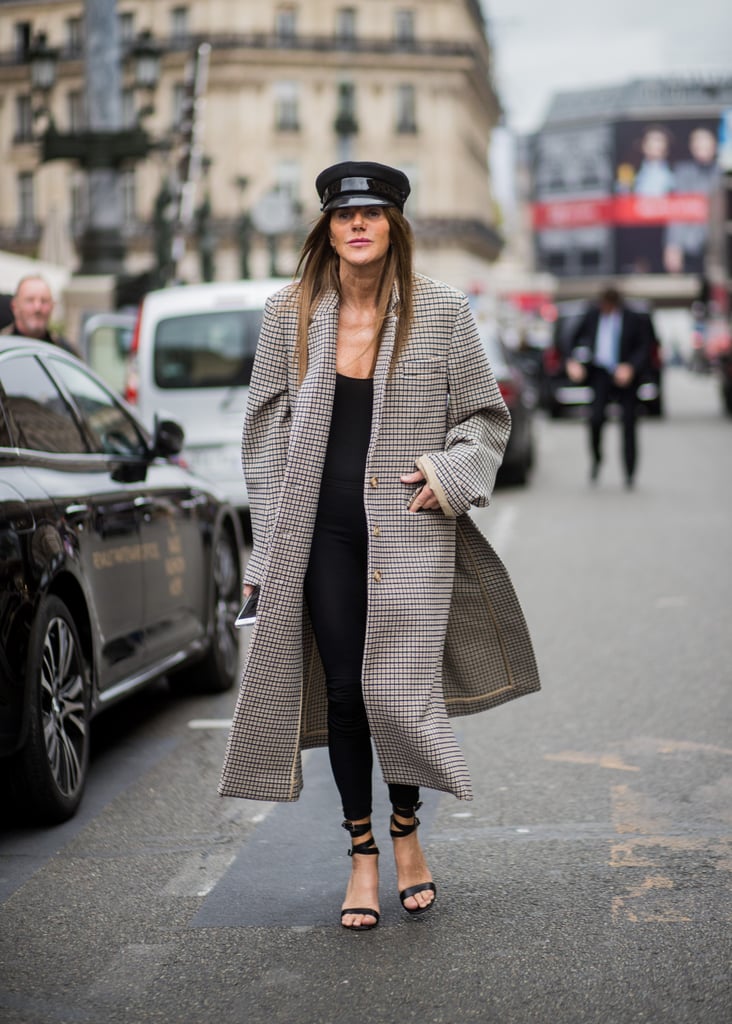 Keep Things Chic and Simple With a Black Cap, Strappy Sandals, and a Long Checked Coat