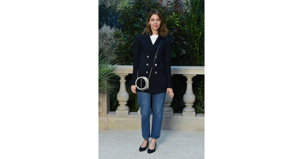 Sofia Coppola dressed casually in a blazer and crossbody bag.