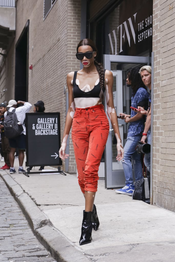 Winnie Harlow Left a Show During NYFW in High-Waisted Red Pants and a Black Bra Top