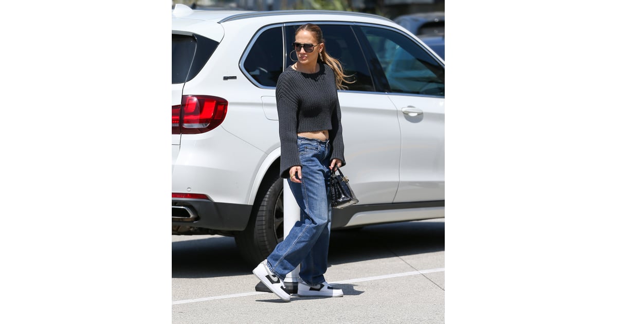 J Lo Wears Low Rise Baggy Jeans And A Cropped Sweater Popsugar