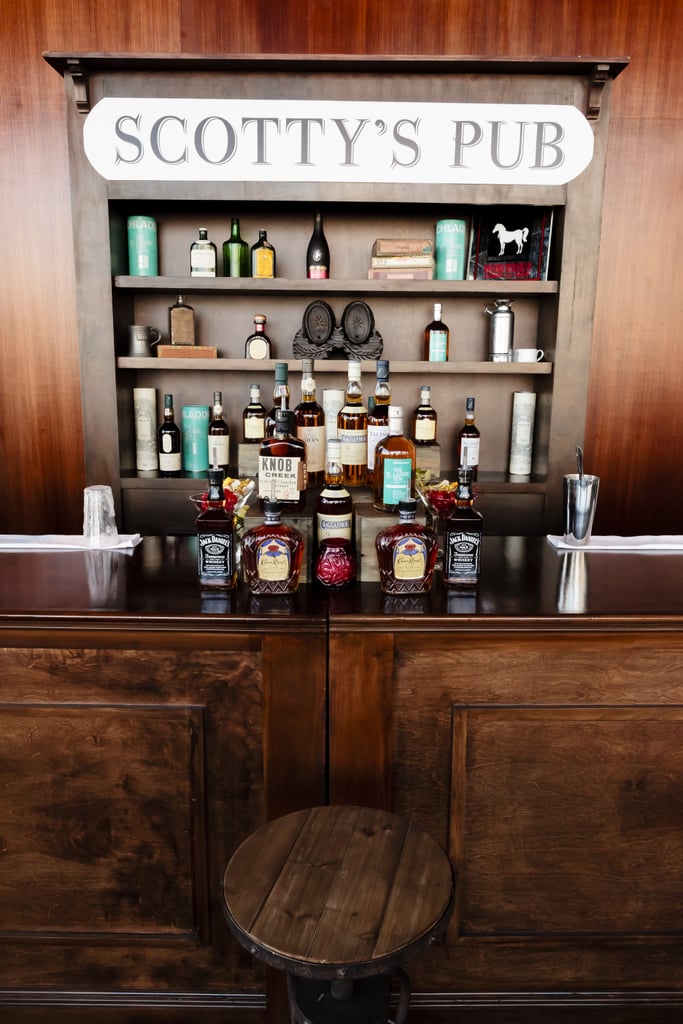 The groom's side was well represented with a scotch bar and lounge area — called Scotty's Pub after Stuart's family — filled with true scotch whiskeys that were actually brought in by his family, some that you couldn't even get here in the States. 
Photo by Chrisman Studios