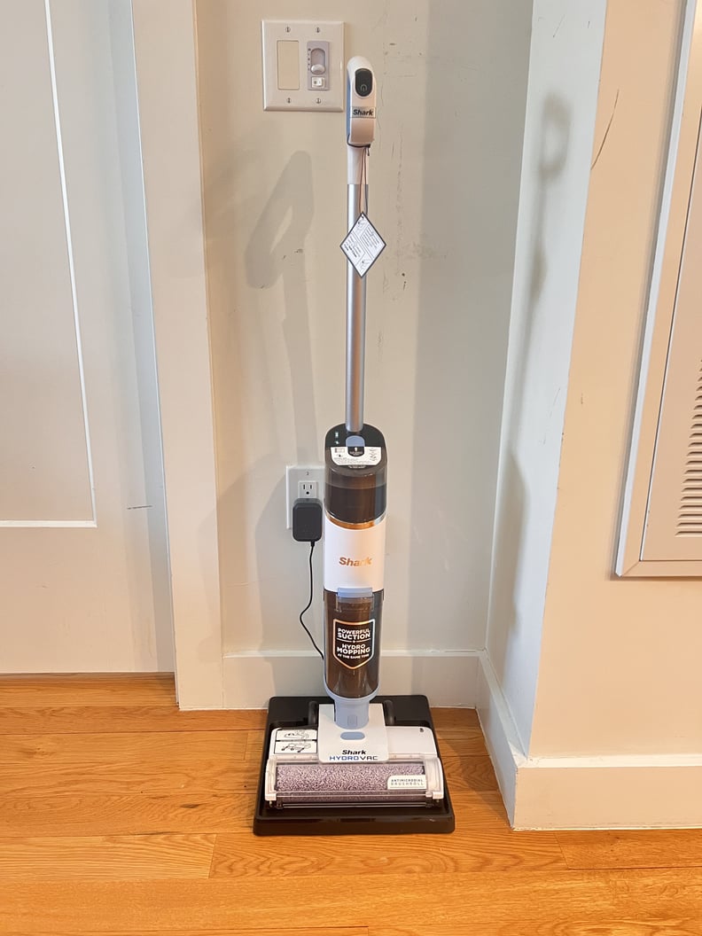 The Shark HydroVac Pro XL Cordless Cleaner against a wall.