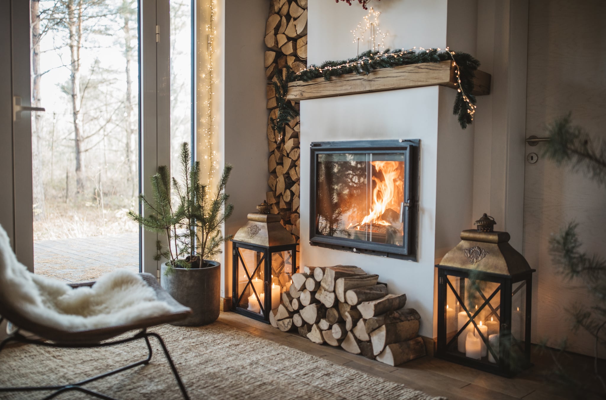 Cosy living room winter interior with fireplace.
