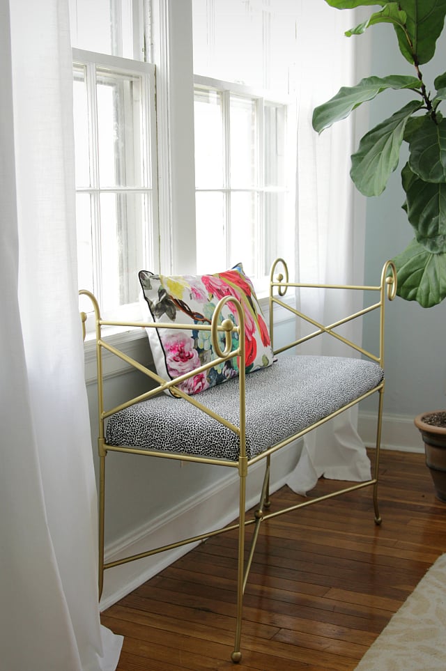 This gold bench is reminiscent of Cinderella's pumpkin carriage — she'd definitely include it in her modern-day castle.