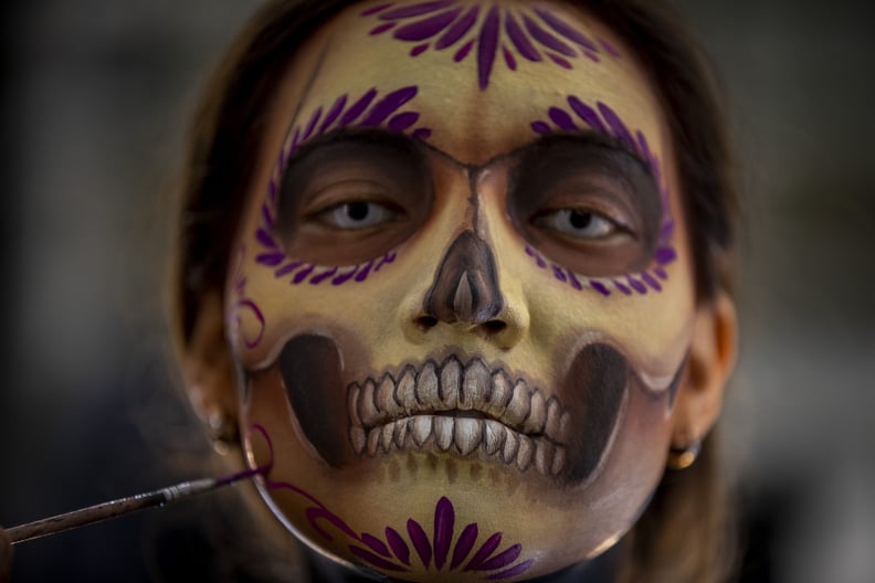 22 October 2021, Mexico, Mexiko-Stadt: Woman wearing Day of the Dead makeup.