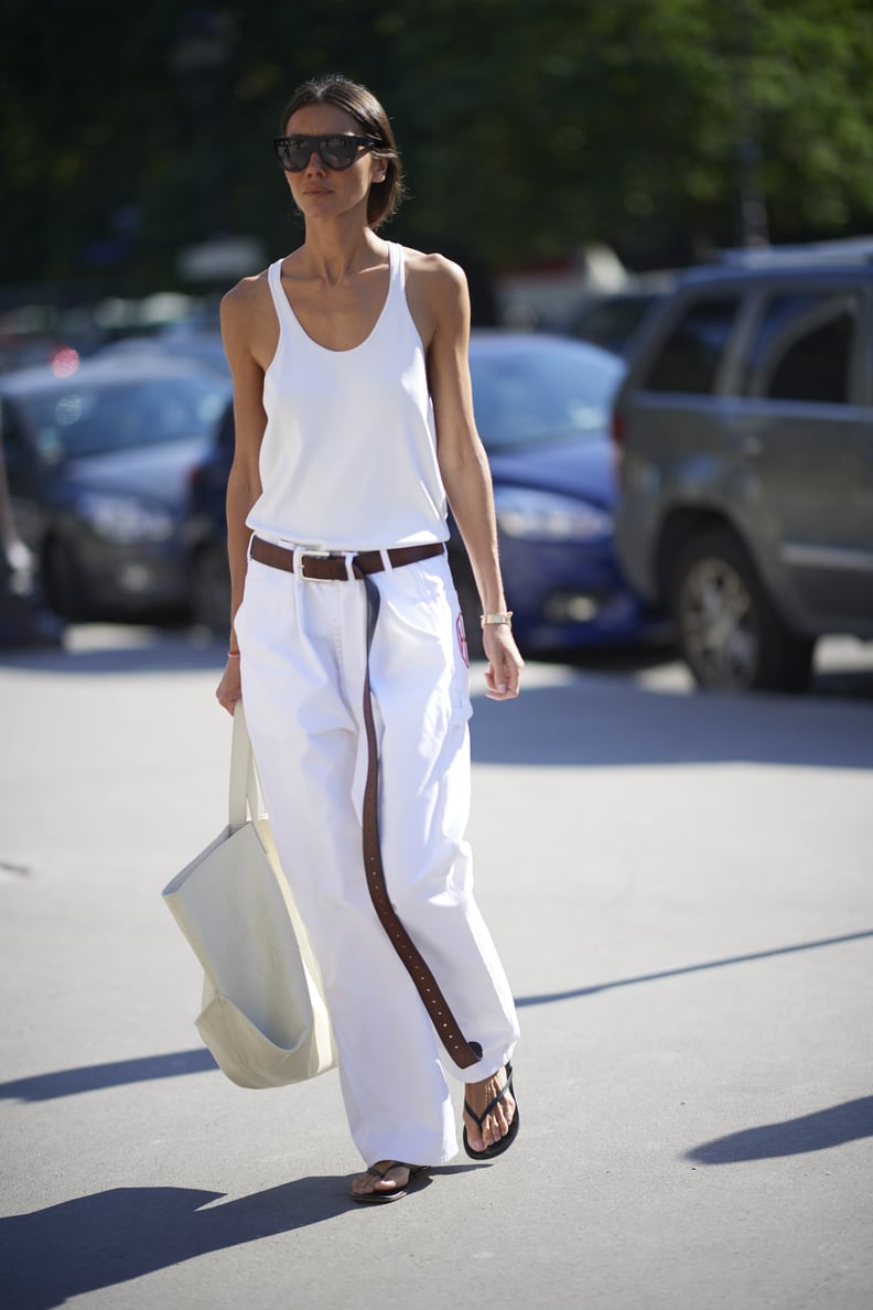 Try Plain Flip-Flops With Baggy White Jeans, a Long Belt, and a Tank