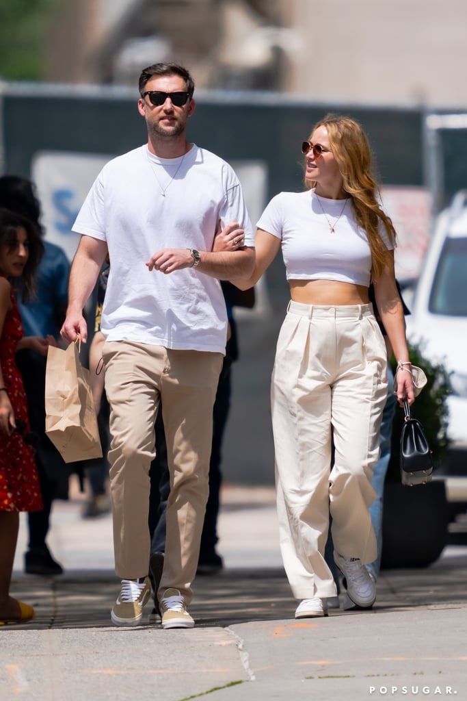 There's an old joke that couples who've been together for a while start to look like each other, but what about couples who dress like each other? Jennifer Lawrence and Cooke Maroney appear to have the coordinating style part of their relationship down to an art. On May 22, the married duo was seen walking the streets of NYC after a lunch date, and their outfit choice is too complementary to ignore. 
The white shirts and khakis paired with sneakers and gold-chain necklaces are just a classic combo. Jennifer opted for a crop top and wide-leg, high-waisted trousers to pull off this look, plus gold-frame sunglasses and a black purse. How chic! Get a closer look at her and Cooke's day-out ensembles in the photos, ahead. 
Related:
Jennifer Lawrence&apos;s Green Spring-Approved Dress Comes in the Cutest Print