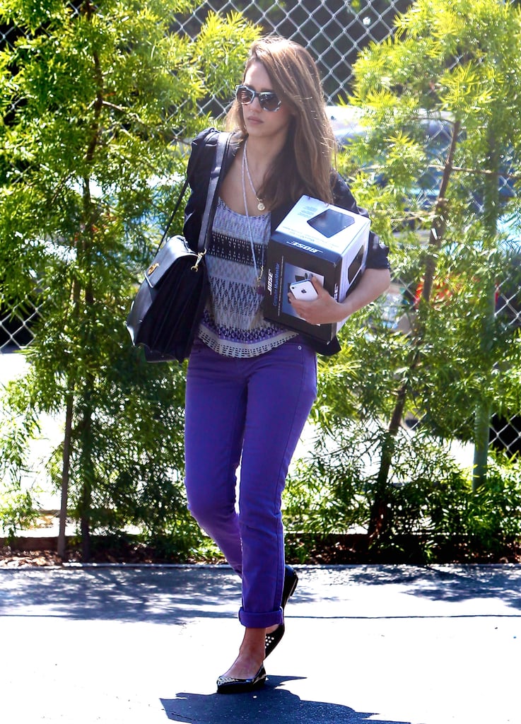 While some may think purple is reserved for children, the actress made a stylish case for the vivid hue, working purple skinny jeans, an Aztec-print tank, and a sleek leather bag and tie-dye shades, both by Tory Burch, on her way to her Santa Monica office.