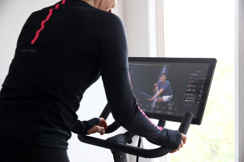 SAN ANSELMO, CALIFORNIA - APRIL 06: Cari Gundee rides her Peloton exercise bike at her home on April 06, 2020 in San Anselmo, California.  More people are turning to Peloton due to shelter-in-place orders because of the coronavirus (COVID-19). Peloton sto