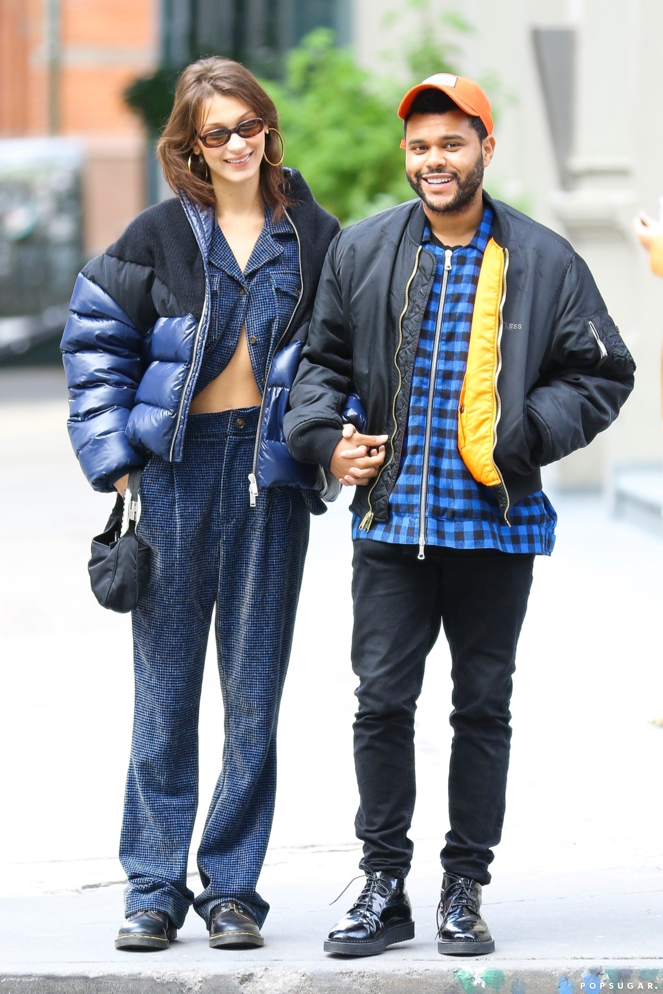 Bella Hadid wore a $1,690 puffer coat over what looked like denim pajamas  during a daytime stroll with The Weeknd