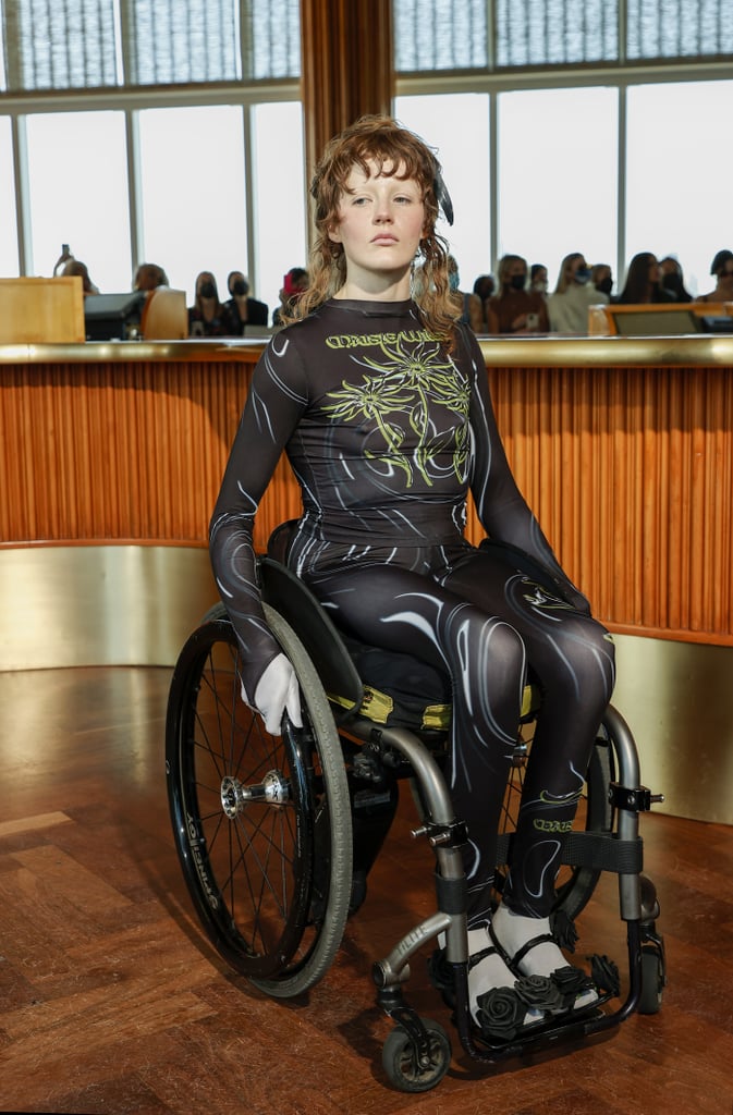 Barker hopes to work with Gucci soon, whether it's rolling for the runway show or posing for a campaign. In the meantime, they're also focused on spreading awareness by starting conversations about ableism that our society can benefit from. 
"Designers should include disabled people as a norm, not just a one-time thing, and they should make all of their stores, shoots, and runways accessible."
"Until the built-in environment is constructed with people with bodies like mine in mind, we will never be able to have equality or participate in fashion the way able bodied people are. We need disabled designers and accessible sewing machines. We need clothes made with the brutality of using a chair and having paralysis in mind. But most importantly, we need the same human rights as everyone else," Barker said, continuing, "[Disabled people] are the largest minority. There should be more than one disabled person in each show. Designers should include disabled people as a norm, not just a one time thing, and they should make all of their stores, shoots, and runways accessible. Collina Strada and 3234u are doing it right." Through Barker's own wardrobe, it's clear these are two labels they love, but they've also curated a handful of their favorite outfits posted to date, along with detailed descriptions of each, for your inspiration and mood board. Check them all out ahead.

    Related:

            
            
                                    
                            

            Why Aren't More Fashion Brands Designing Adaptive Clothing?