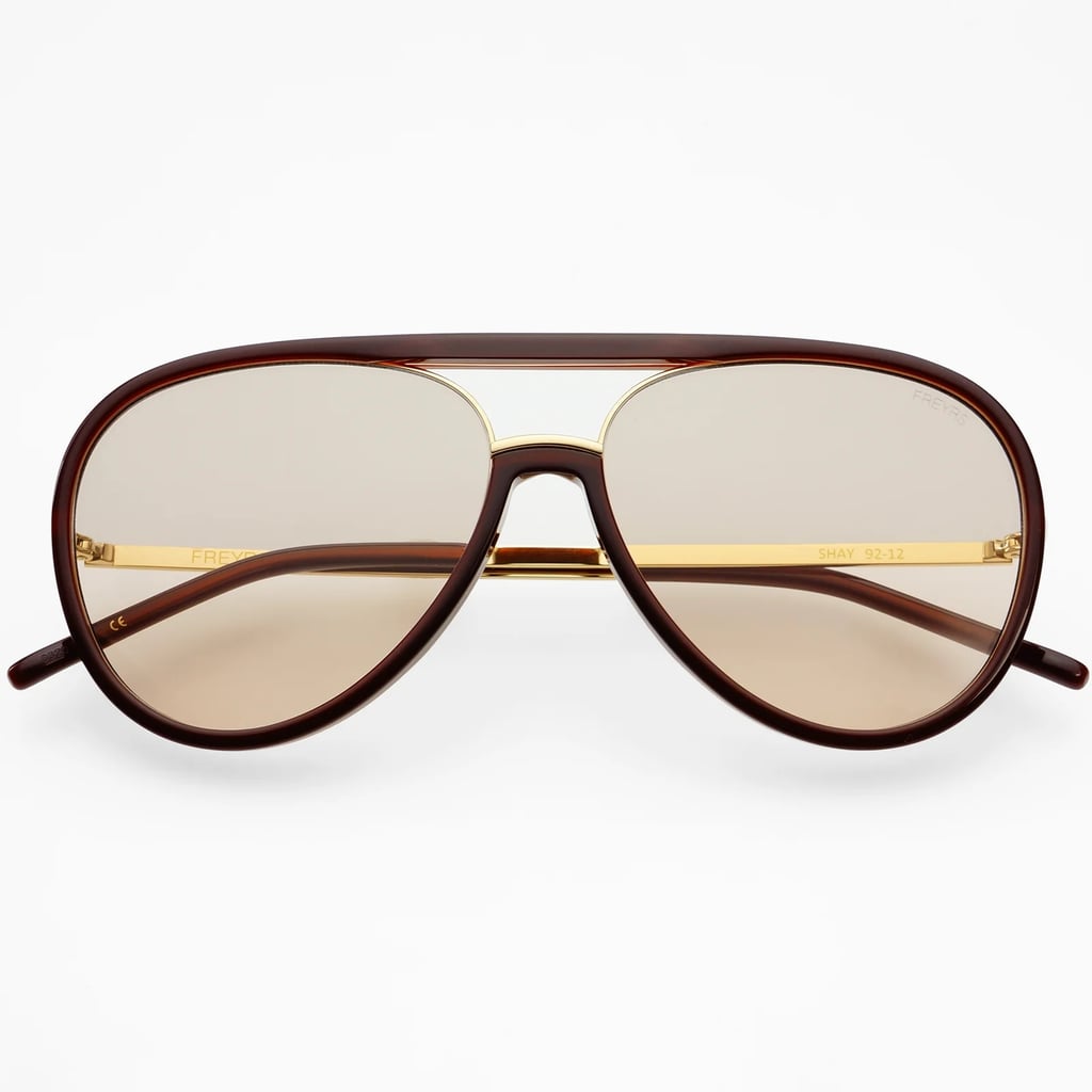 Freyrs Shay Sunglasses ($85)
Consider this proof that not all aviators have to be "Top Gun"-approved. This reimagined frame has no metal nose pads for added comfort (aka they won't get stuck in your hair). But they do have an eye-catching chrome-gold lining and soft, round edges for a sleek, minimal style.
