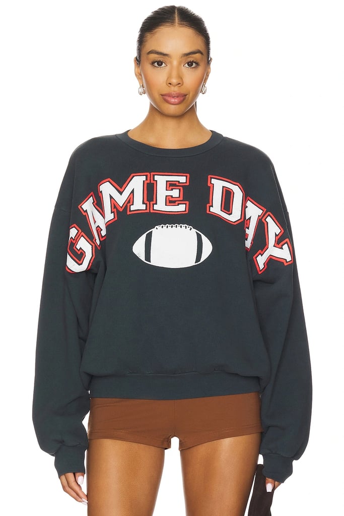 DAYDREAMER Game Day Crew Sweatshirt ($124)
 Another option to keep it neutral is this crewneck Game Day sweatshirt. It's perfect for wearing to your local bar or at home while watching the game. Dress it up with earrings or pair it down with sweatpants. It works either way.