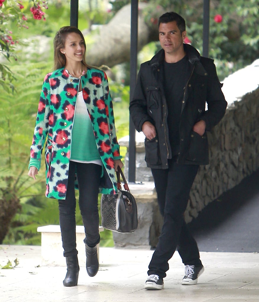 pJessica Alba brightened her washed black denim with a high-wattage Kenzo coat while attending Jessica Simpson's baby shower in Beverly Hills. Husband Cash looked just as cool in his monochrome look.