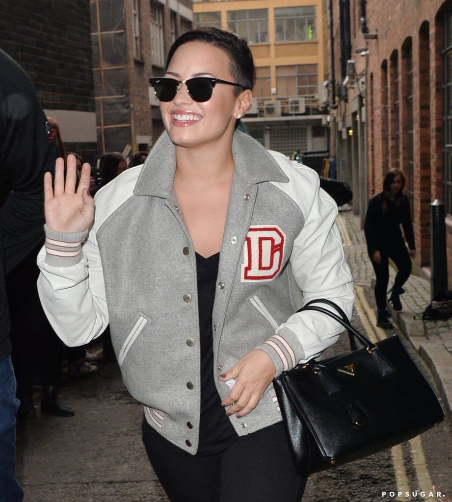 On Saturday, Demi Lovato showed off her pearly whites in London.
