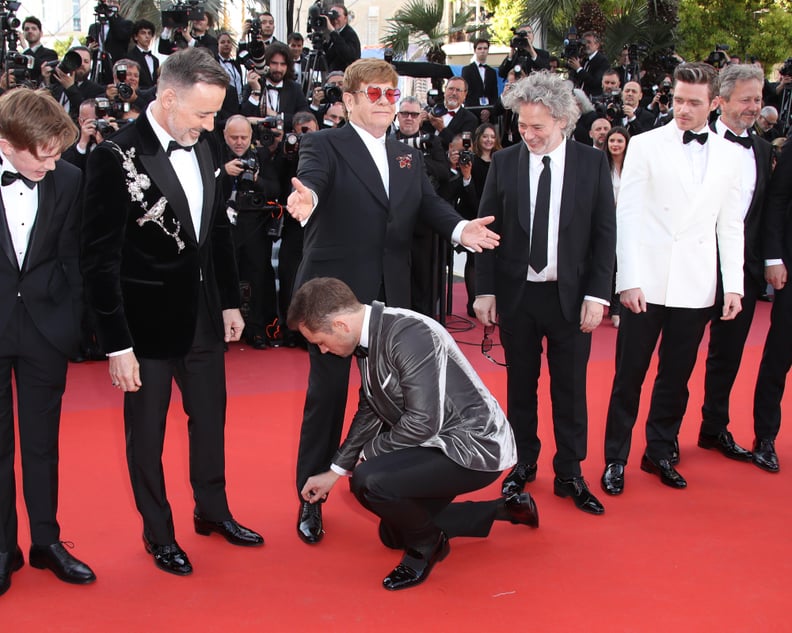 Finally, Taron Adds 1 Last Touch to Elton's Now Properly Tied Shoe