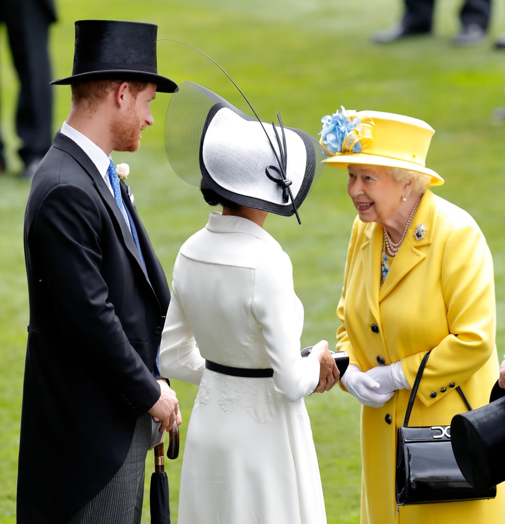 Queen Elizabeth chats with Prince Harry and Meghan Markle at the Royal Ascot on June 19, 2018.