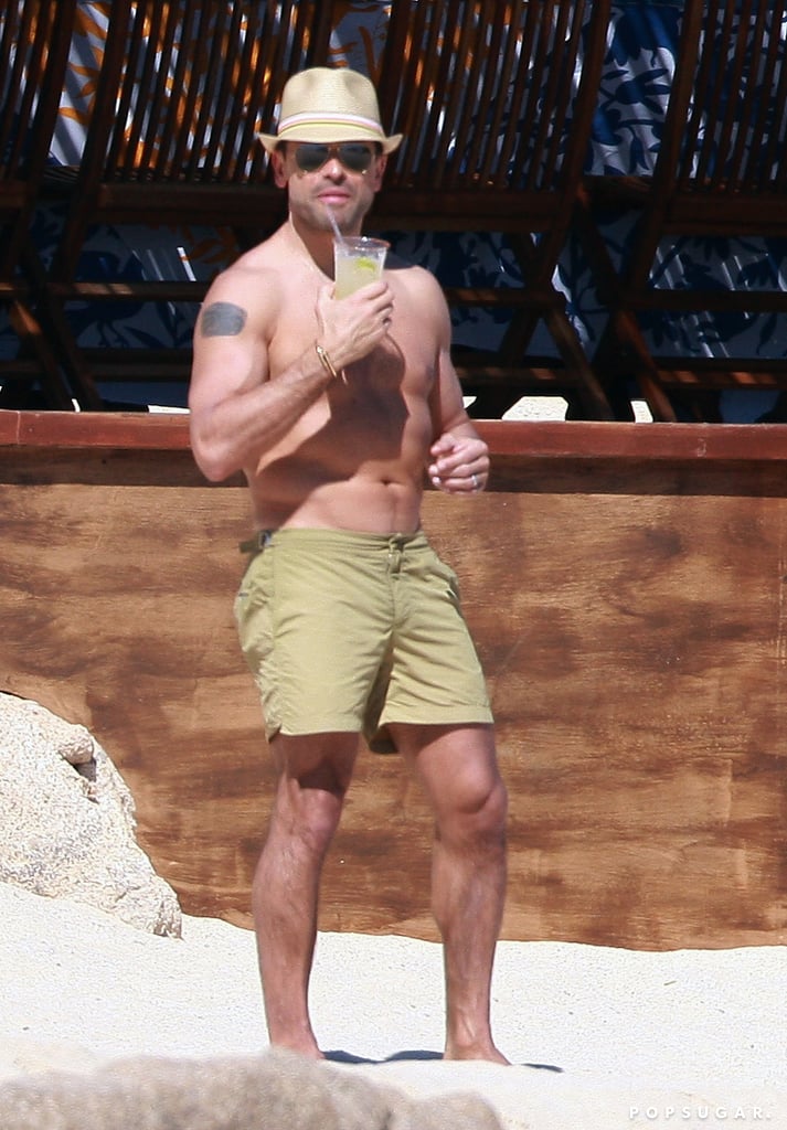 Mark Consuelos sipped a drink on the beach.