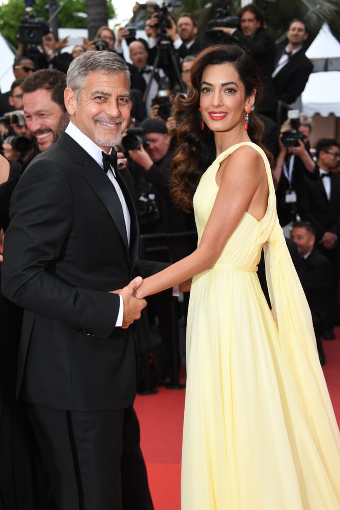 George on proposing to Amal: "I'm the cook in the family. Believe me, Amal makes reservations. I did pasta of some form, not that impressive. And then over champagne, after dinner, I told her there was a lighter to light the candle in the drawer, and she reached back and pulled out a ring. And I did all the stuff, got down on my knee and did all the things you're supposed to do. I had a playlist with my Rosemary songs on it [his late aunt was the singer Rosemary Clooney], and I was waiting for this song, 'Why Shouldn't I?' 'Why shouldn't I take a chance when romance passes by? / Why shouldn't I know of love?' It's a really good song about why can't I be in love? And it played, and she's like, 'Holy sh*t!' And she just kept staring at the ring, going, 'Oh, my god.' It was 20 minutes of me on my knee, waiting for her to say yes, because she was so shocked. She only said yes when 'Goody, Goody' came on, which isn't very romantic — it's kind of mean: 'So you met someone who set you back on your heels, goody, goody.'" 
George on Amal’s delayed response to his proposal: "My only doubt was if she thought maybe it was too soon. But there was no doubt that we were the right couple and that we were the right team. And we were a team from right off the bat. Immediately, we felt we were just happy, and we have been happy ever since."