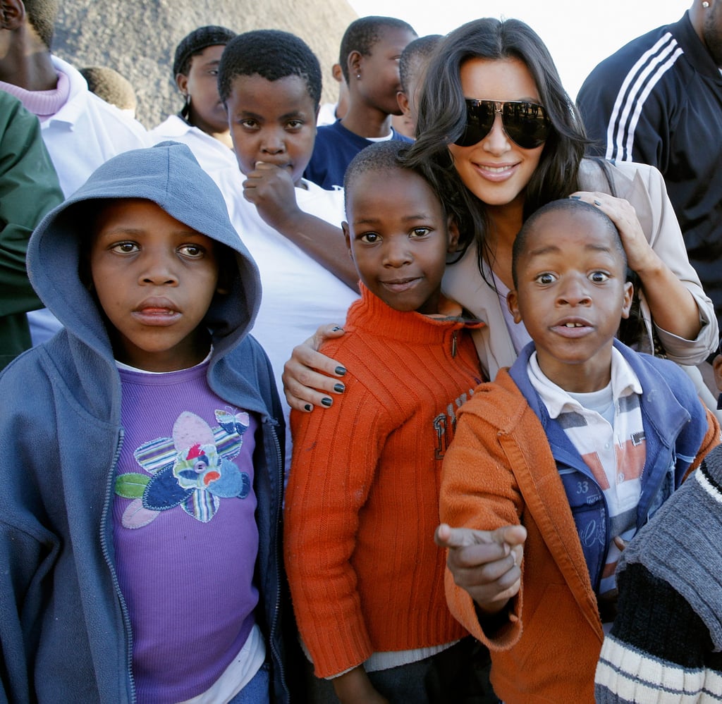 She posed with local children during a visit to the Motswedi Rehabilitation Centre in Botswana in July 2009.