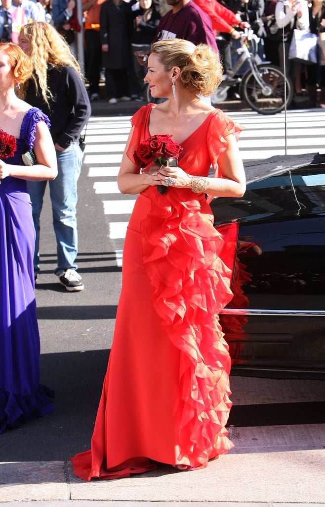 En route to Carrie's disastrous would-be wedding, Samantha is quite the head-turner in a ruffled red confection. Just look at her train!