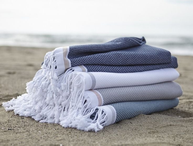 This Coyuchi beach towel ($69) is made of absorbent organic cotton, so you'll feel extragood about the purchase when you realize it can double as a chic sarong. 
— Allie Merriam, contributing editor