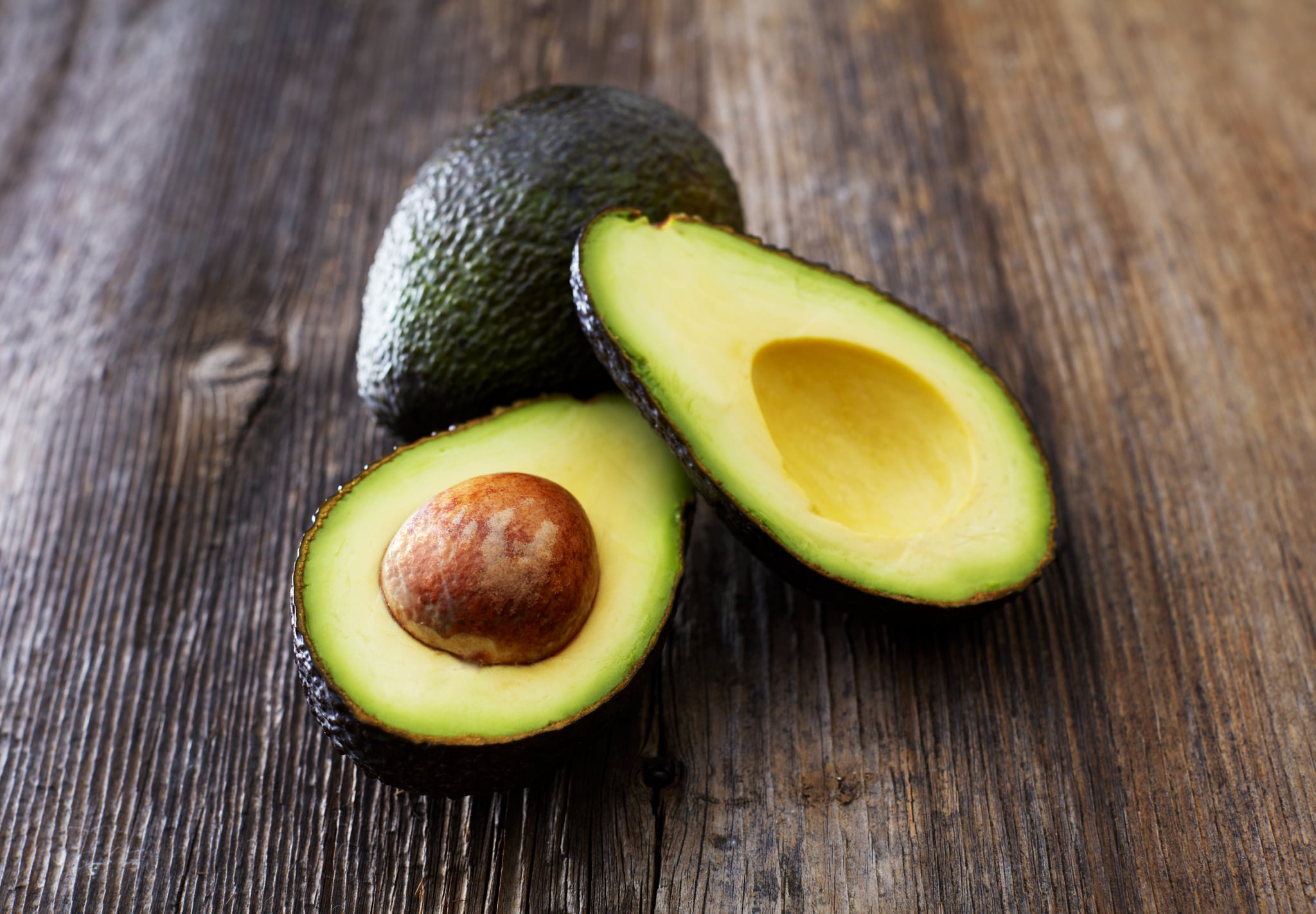 Avocados on a table illustrating health benefits of avocado