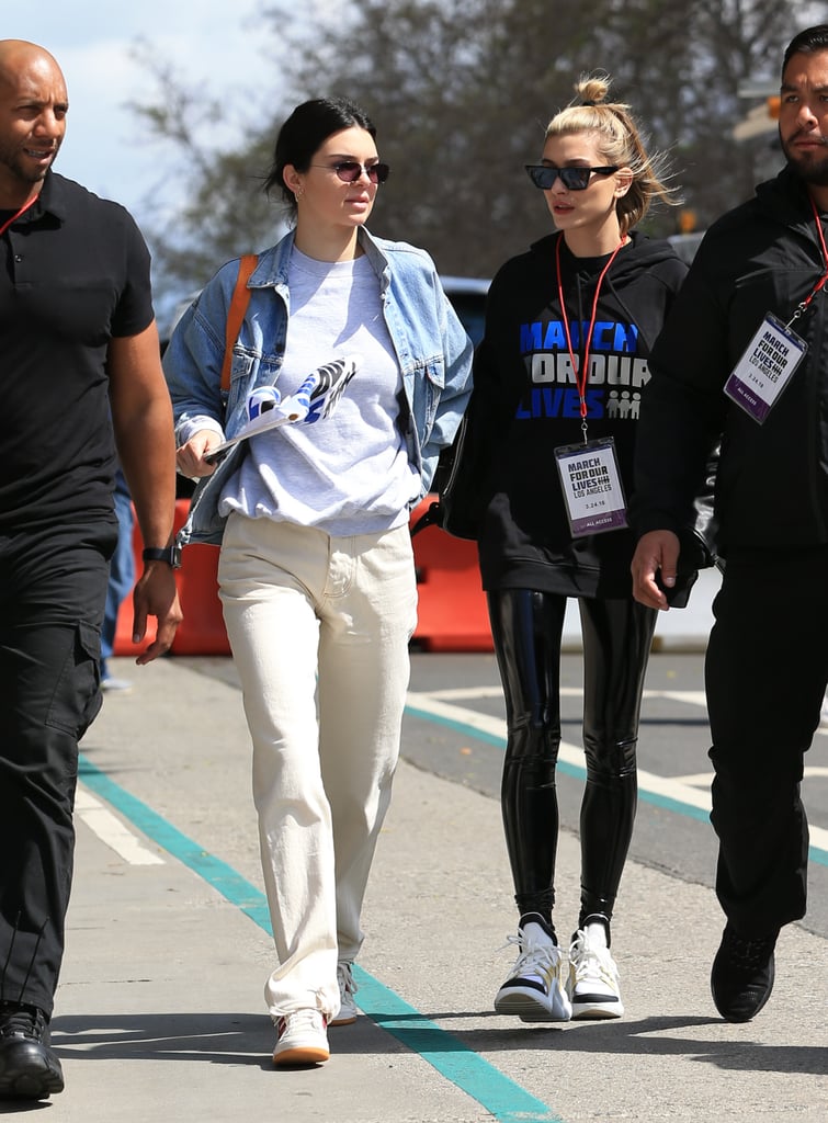 Kendall and pal Hailey Baldwin went casual for LA's March For Our Lives. Kendall started with a foundation of Adidas Forum sneakers with red stripes and khaki-coloured denim. She wore a Yeezy crew neck sweatshirt, a metallic Heron Preston bag, and R13's denim jacket.