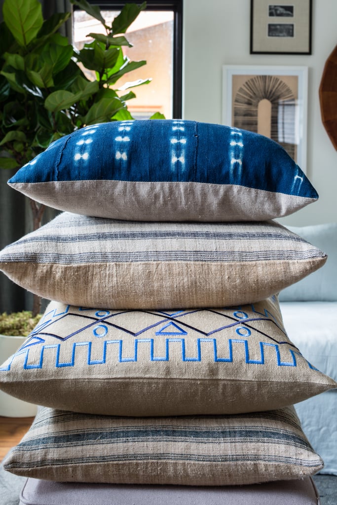 Let the things you love dictate your color palette: Erica's obsession with shibori tie-dye and willow-patterned china made the color palette decision a no-brainer. While there are loads of neutrals in the room, Alex placed accessories in the same blue and white tones throughout the space to create a cohesive theme.