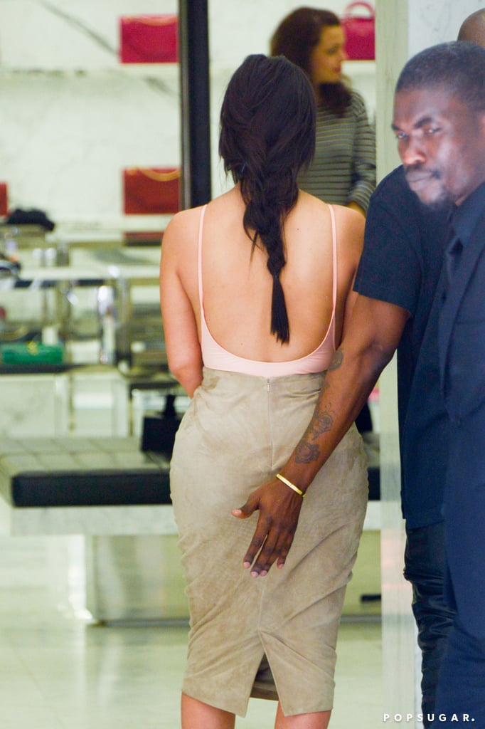 Kanye grabbed Kim's famous bum during their shopping trip.