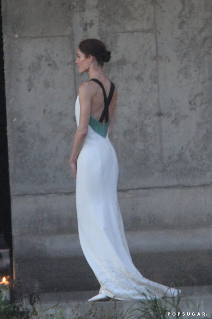 The back of Hilary's dress featured crisscross straps and an elegant trail of buttons.