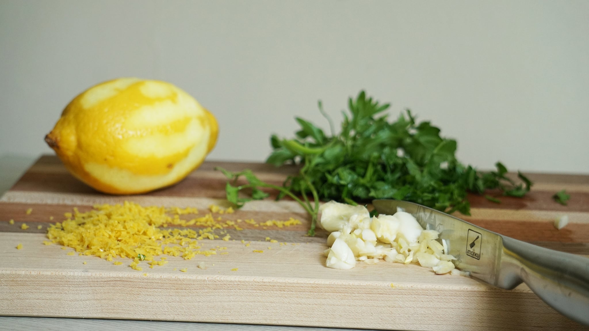 dirty martini pasta recipe ingredients on a cutting board