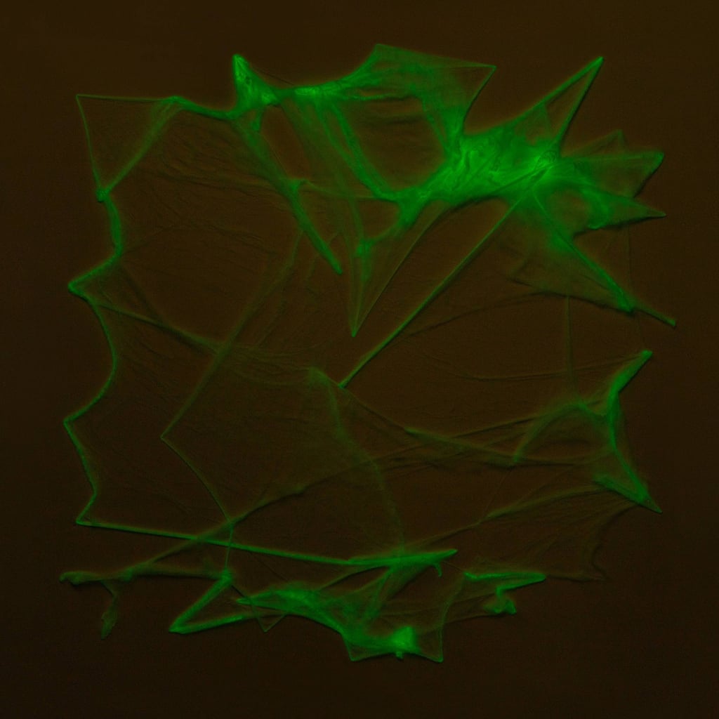 A Glowy Detail: Spiderweb Stretch Glow Halloween Decorative Prop