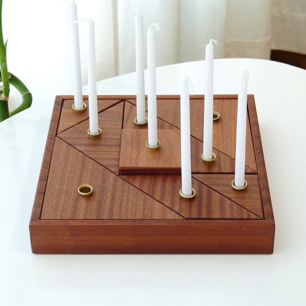 For a contemporary take on Hanukkah decor, shoppers are loving this Modular Wooden Tangram Menorah ($268).