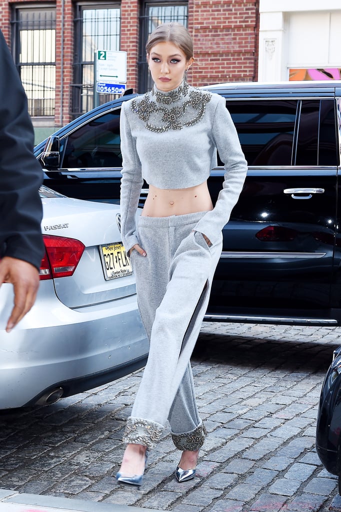 Gigi's all-gray outfit looked warm and cozy. She wore a crystal embellished crop top and sweatpants with side slits from Sally LaPointe's Pre-Fall 2017 collection and Stella Luna silver metallic pumps.