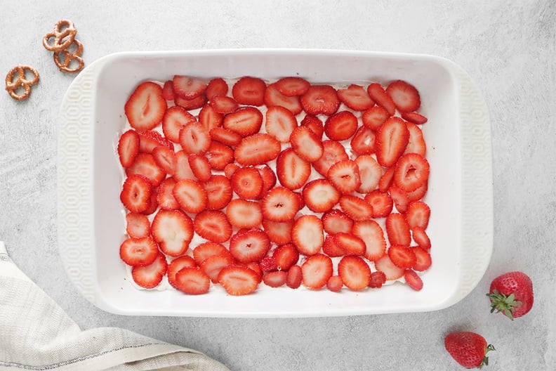 Whipped cream and strawberries in a baking dish