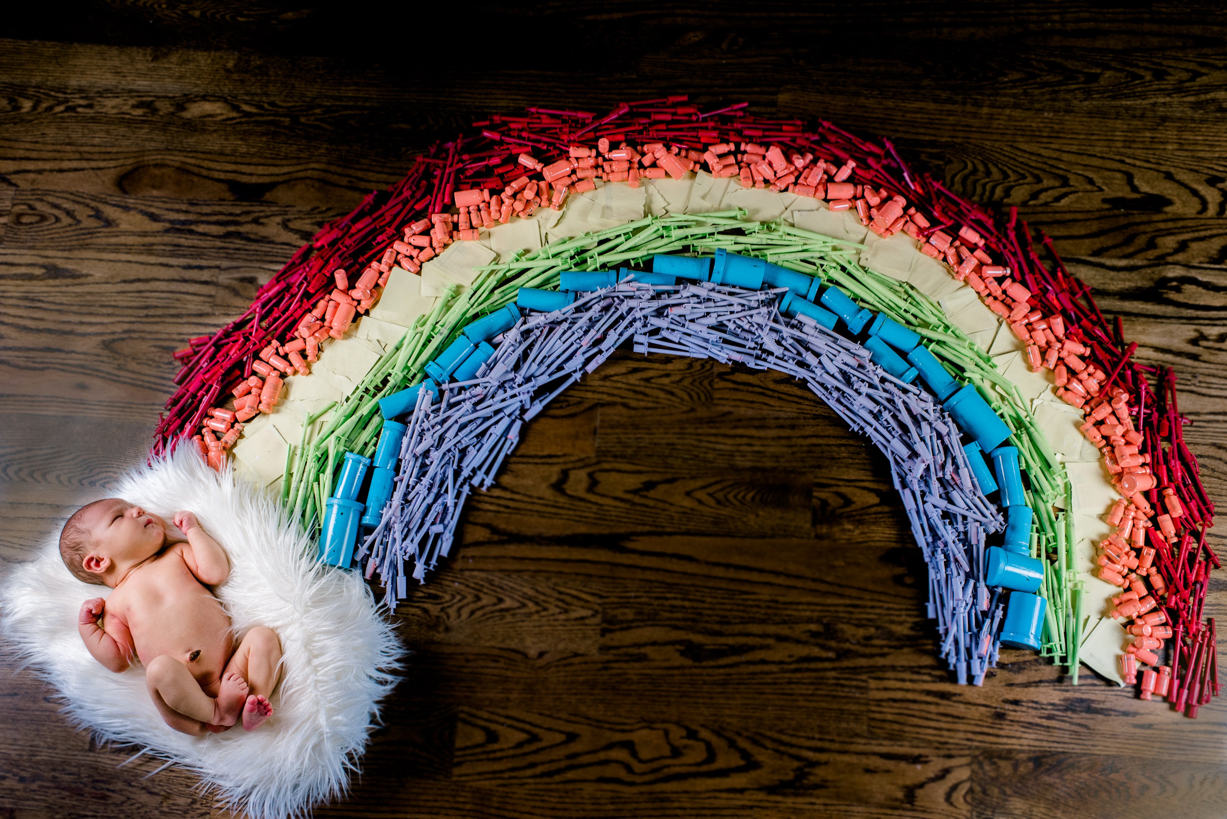 Photo of 'Rainbow' Baby Surrounded by Mother's Syringes Goes Viral