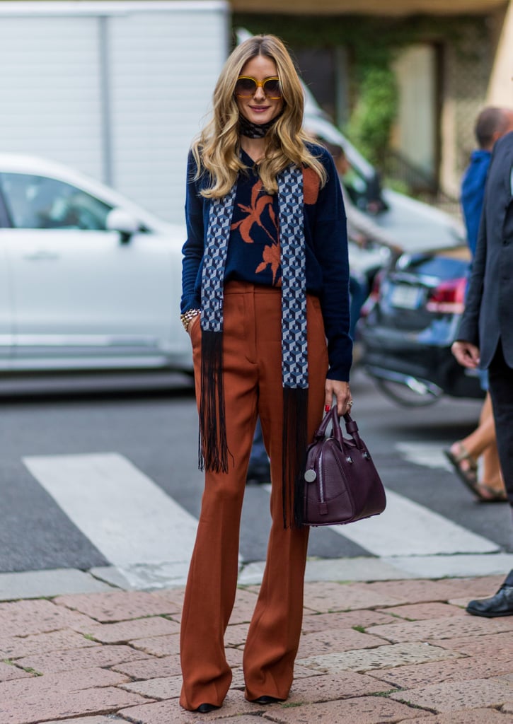 The shade of Olivia's MAX & Co pants complimented the pattern on her navy sweater.