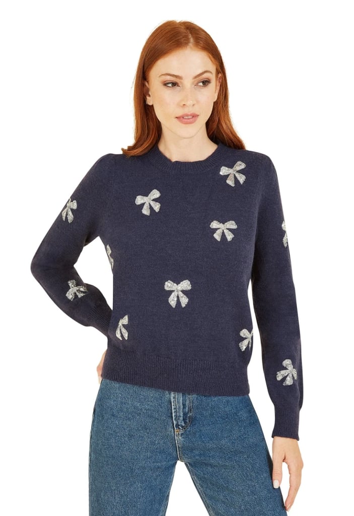 Classy Christmas Jumpers: Yumi Navy Sequin All Over Applique Bow Knitted Jumper